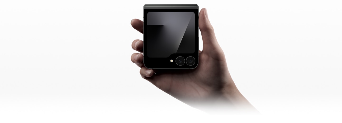 Galaxy Z Flip7 FE in Black is seen unfolded. As it rotates, it folds completely until the cover screen is seen. It is pocketable enough to fit in your hand.